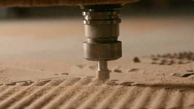 A close-up shot of the nozzle of a 3D printer depositing a layer of concrete with precision. The layers are visible and indicate the construction of a wall.