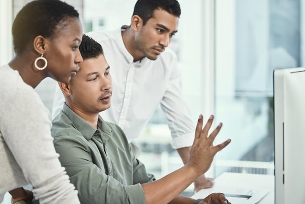 A diverse group of employees participating in a cybersecurity training session. The scene is well-lit and professional, with employees actively engaged in the presentation. There are graphics on the screen showing examples of phishing emails and safe password practices.