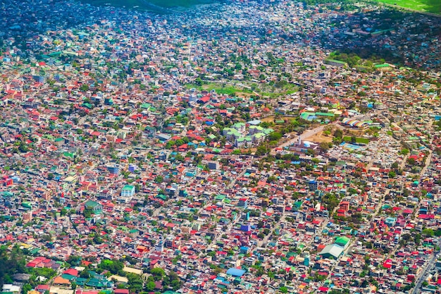An aerial view of the Círio de Nazaré procession in Belém, Pará, showing thousands of people gathered along the streets, carrying the image of Nossa Senhora de Nazaré. The image captures the devotion and scale of this religious and cultural event.