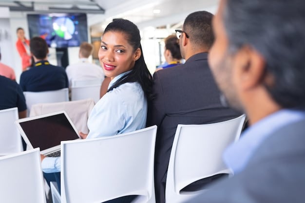 A diverse group of people attending a cybersecurity awareness workshop in Brazil, with a presenter explaining key concepts on a screen. The atmosphere is interactive and engaging, promoting a culture of security awareness.